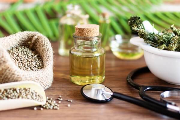 bottles-hemp-oil-with-cannabis-seeds-dry-leaves-alternative-medicine-concept