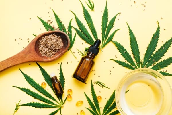 composition-with-bottle-cbd-oil-serum-hemp-leaves-seeds-balm-relaxing-oil-healing-hemp-products-concept-creating-natural-cosmetics