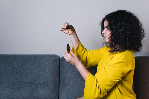 adult-woman-using-holding-medical-cannabis-oil-cbd