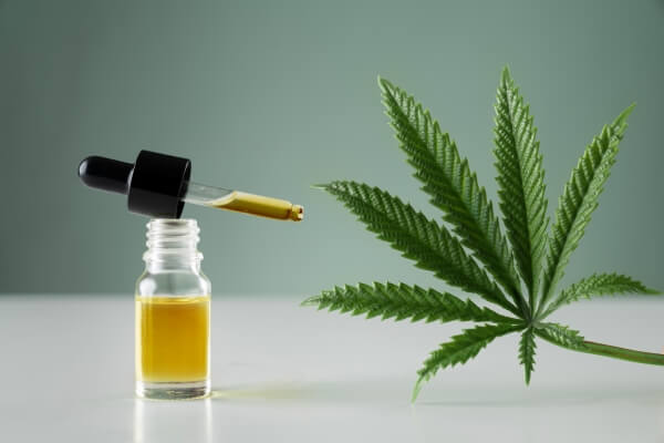 legalized-cannabis-sativa-hemp-leaf-container-cbd-oil-with-dropper-lid